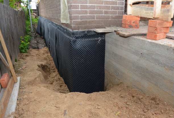 Happy homeowners after waterproofing job in Rushford
